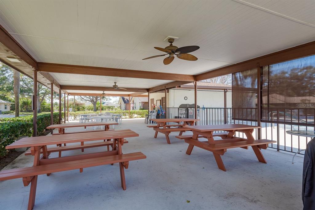409 Stirling Terrace Dunedin, FL 34698 - Photo 17 of 17 a living room with furniture and a floor to ceiling window