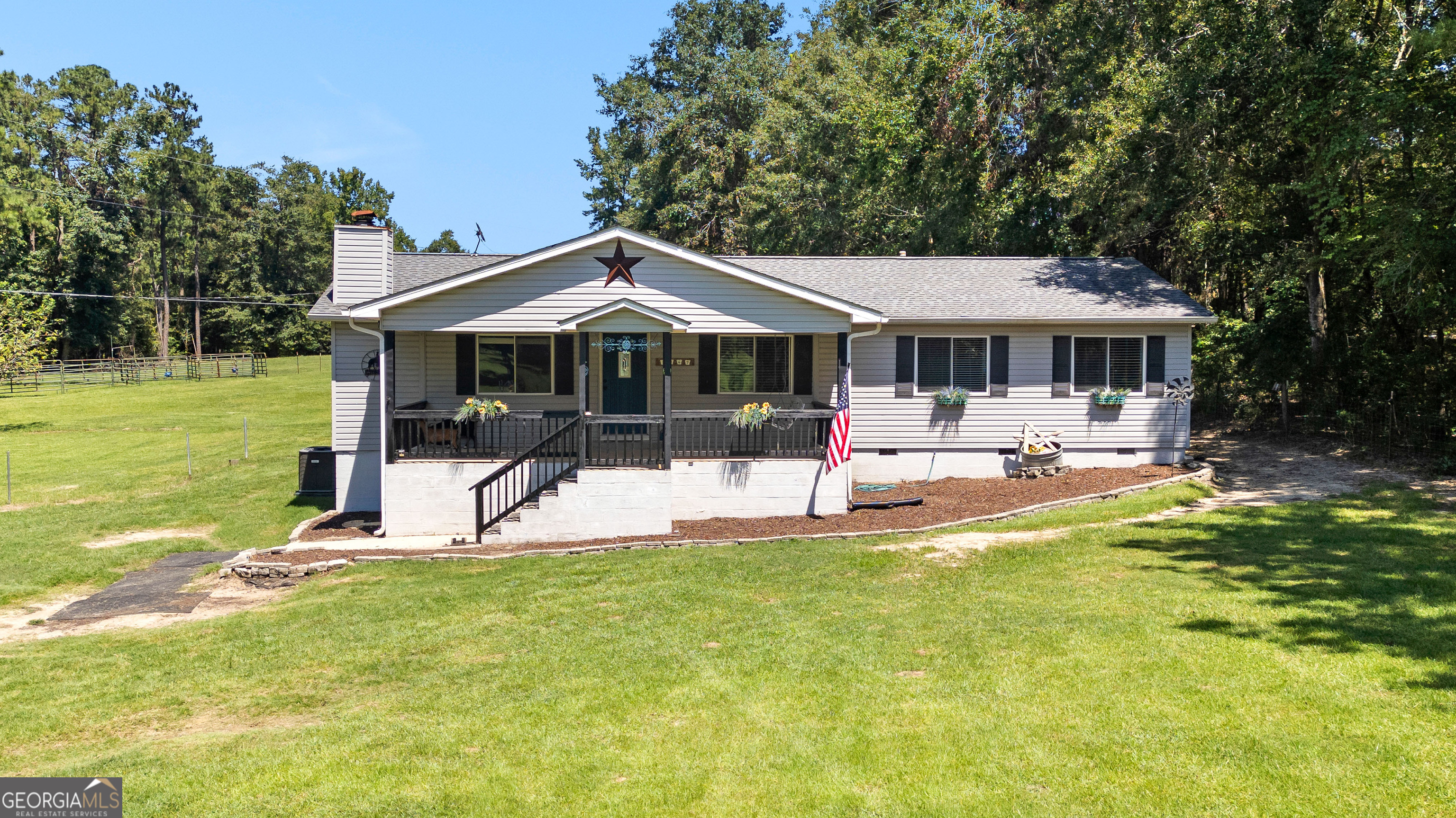 1967 Carl Sutton Road Lizella, GA 31052 - Photo 1 of 1 a view of a house with a yard patio and fire pit