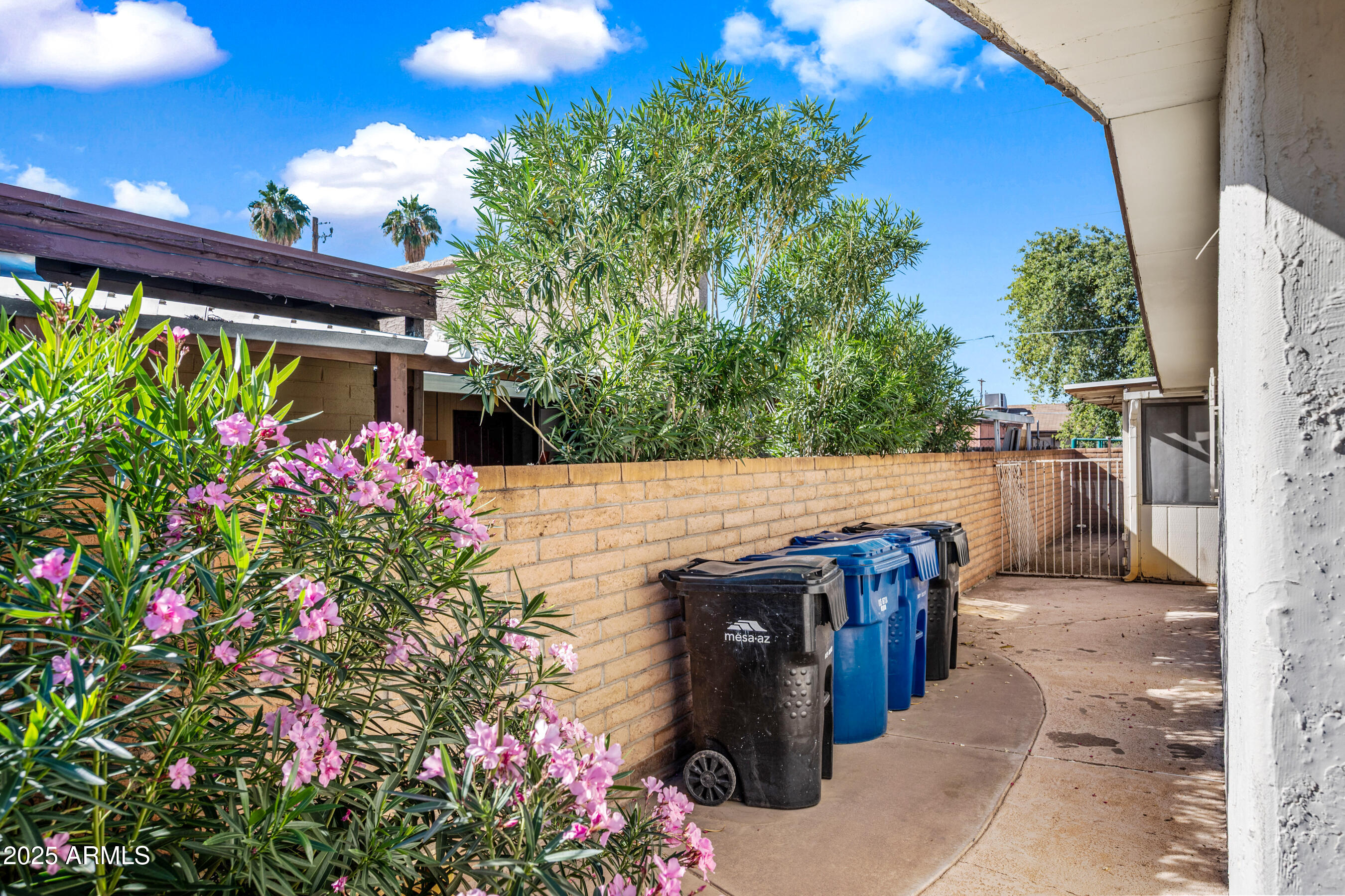 1138 North Dresden Circle Mesa, AZ 85203 - Photo 16 of 27 a view of a patio with table and chairs and potted plants