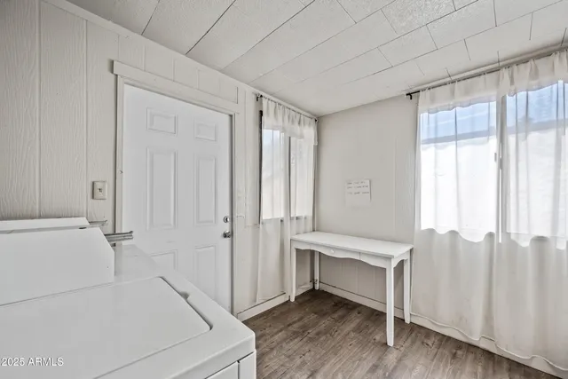 a view of a kitchen with furniture and a kitchen