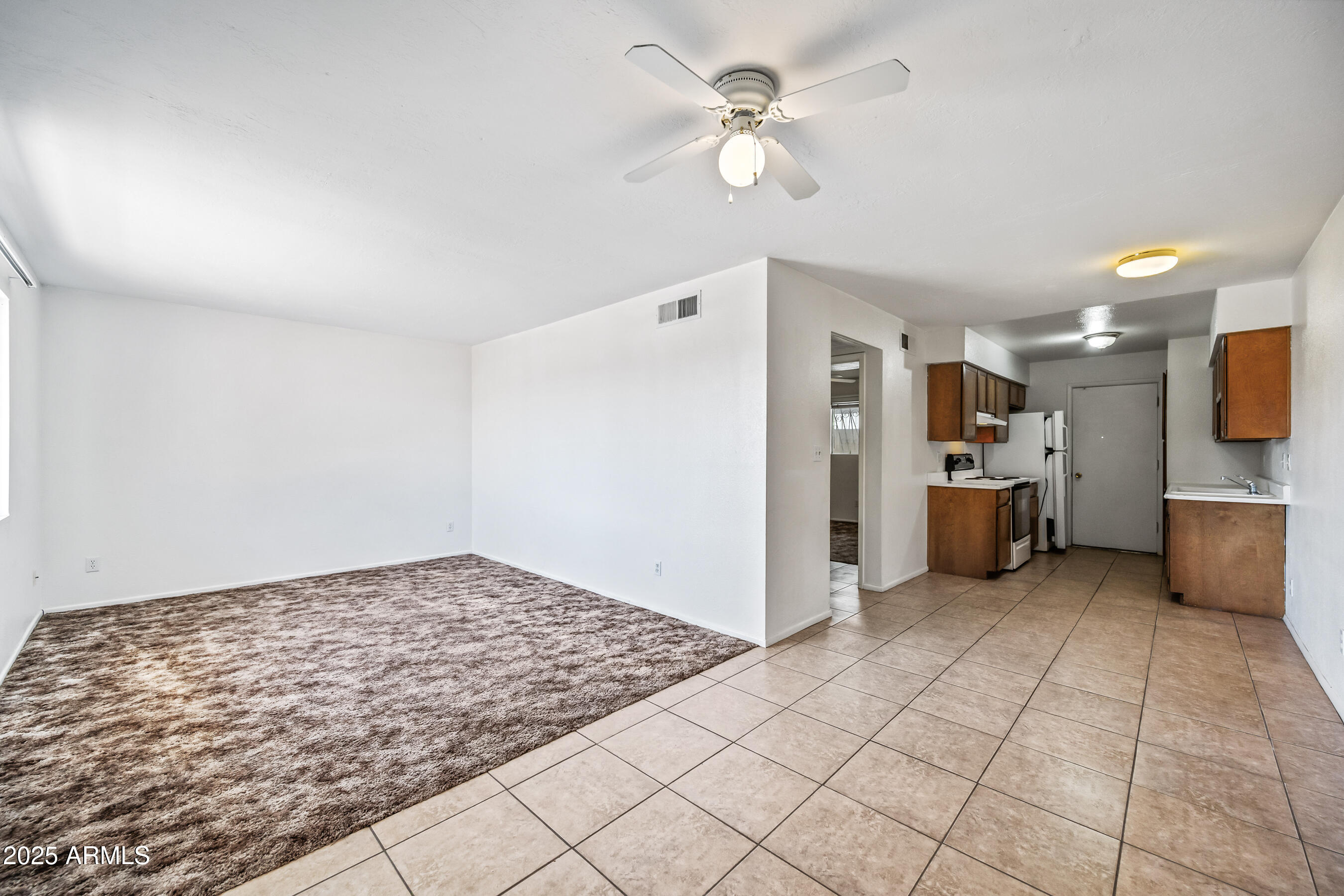 1138 North Dresden Circle Mesa, AZ 85203 - Photo 23 of 27 a view of a kitchen with furniture and a kitchen