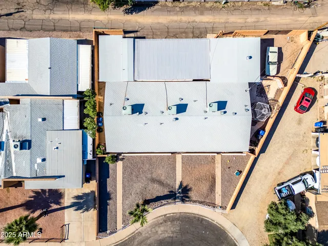 an aerial view of a house with sitting area