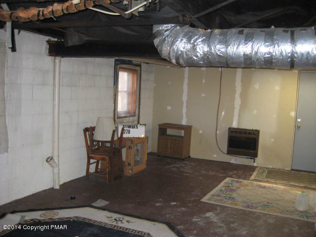 225 Haystack Road Henryville, PA 18332 - Photo 8 of 18 a view of a livingroom with furniture and chandelier