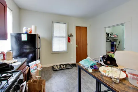 a work room with furniture and a window