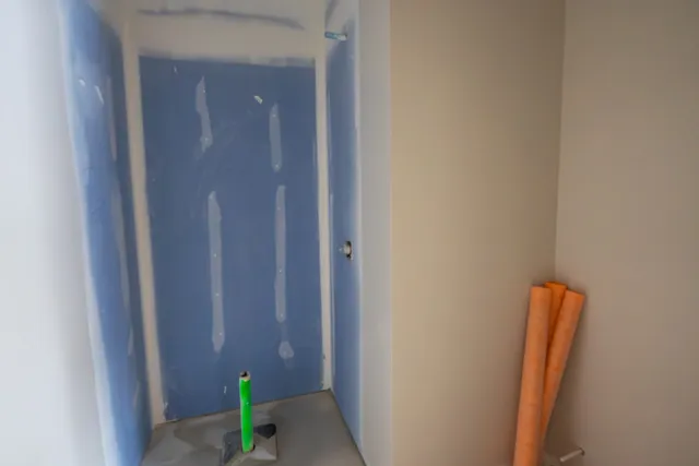 a view of house with garage and yard