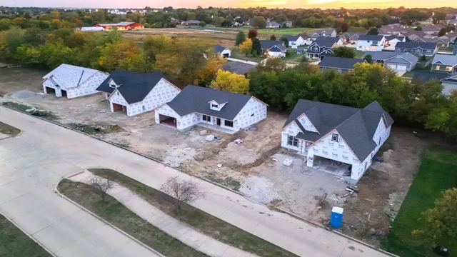 an aerial view of a house with a lake view