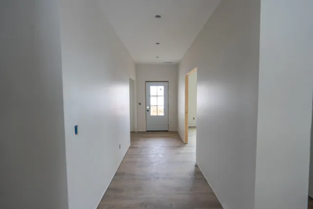an empty room with wooden floor