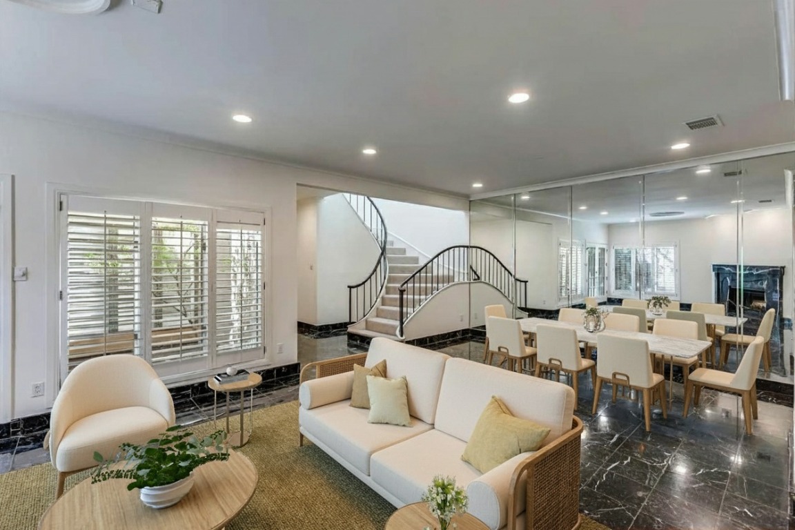 a living room with furniture chess floor and a large window