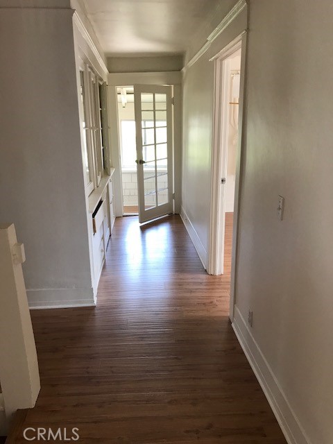 1624 South Gramercy Place Los Angeles, CA 90019 - Photo 14 of 20 wooden floor in an empty room with a window