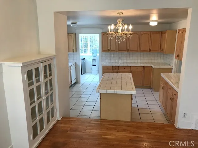 a view of a kitchen with a sink and cabinets