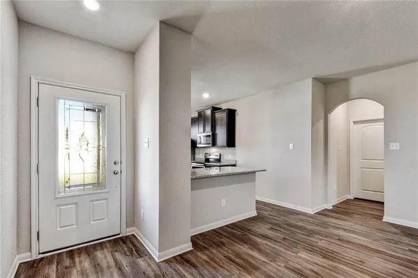 a view of a kitchen from the hallway