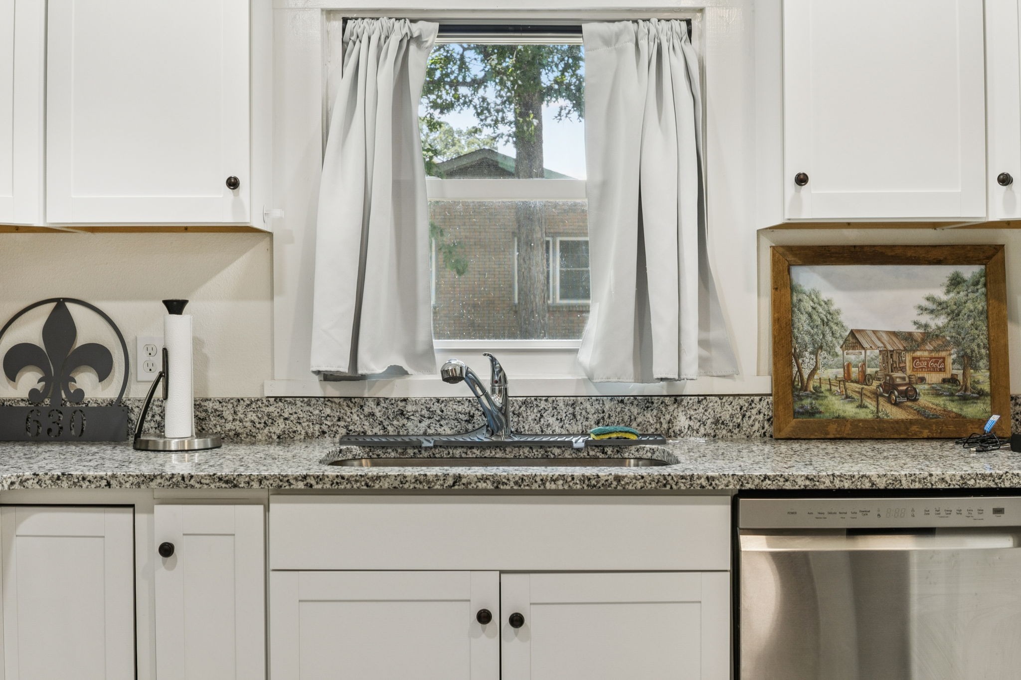 630 Lakeview Court Tennessee Ridge, TN 37178 - Photo 11 of 76 a bathroom with granite countertop white cabinets and a sink