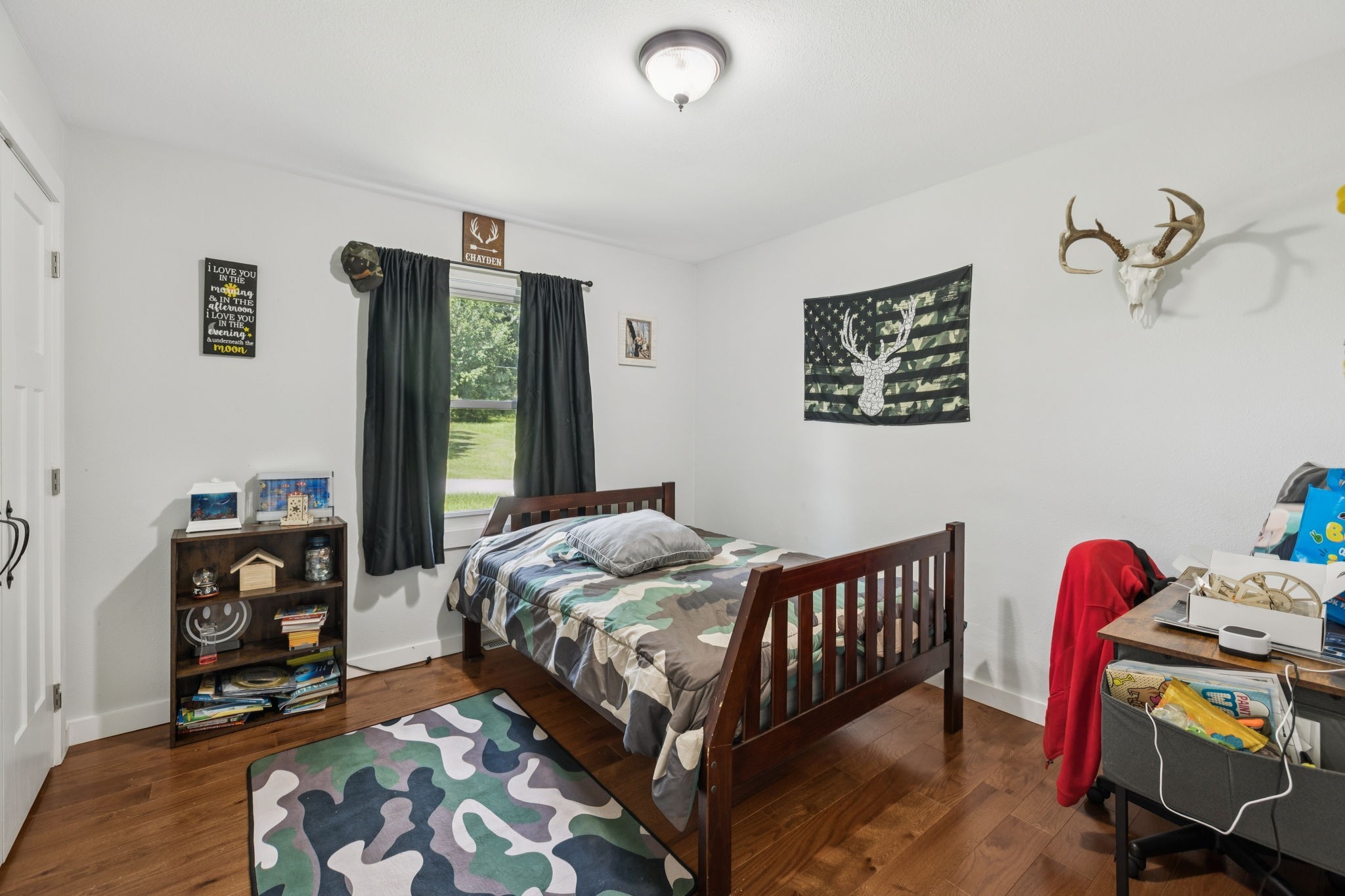 630 Lakeview Court Tennessee Ridge, TN 37178 - Photo 19 of 76 a bedroom with a bed and wooden floor