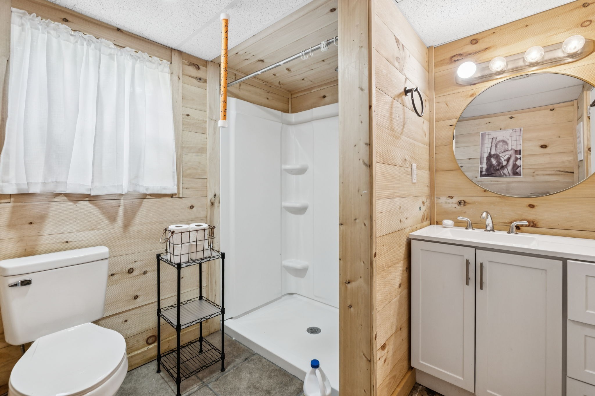 630 Lakeview Court Tennessee Ridge, TN 37178 - Photo 29 of 76 a bathroom with a sink toilet and shower