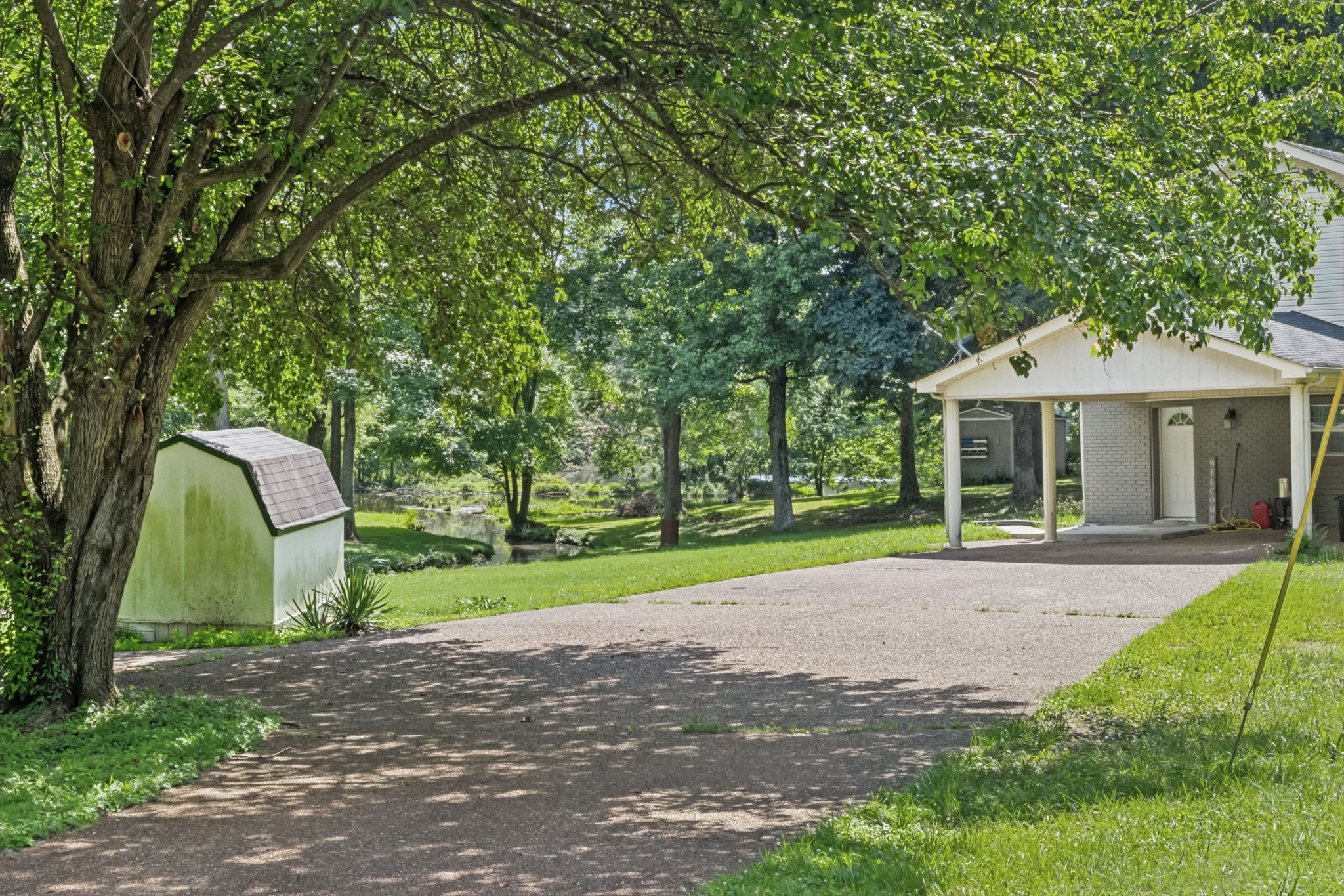 630 Lakeview Court Tennessee Ridge, TN 37178 - Photo 43 of 76 a view of a house with a backyard and a garden