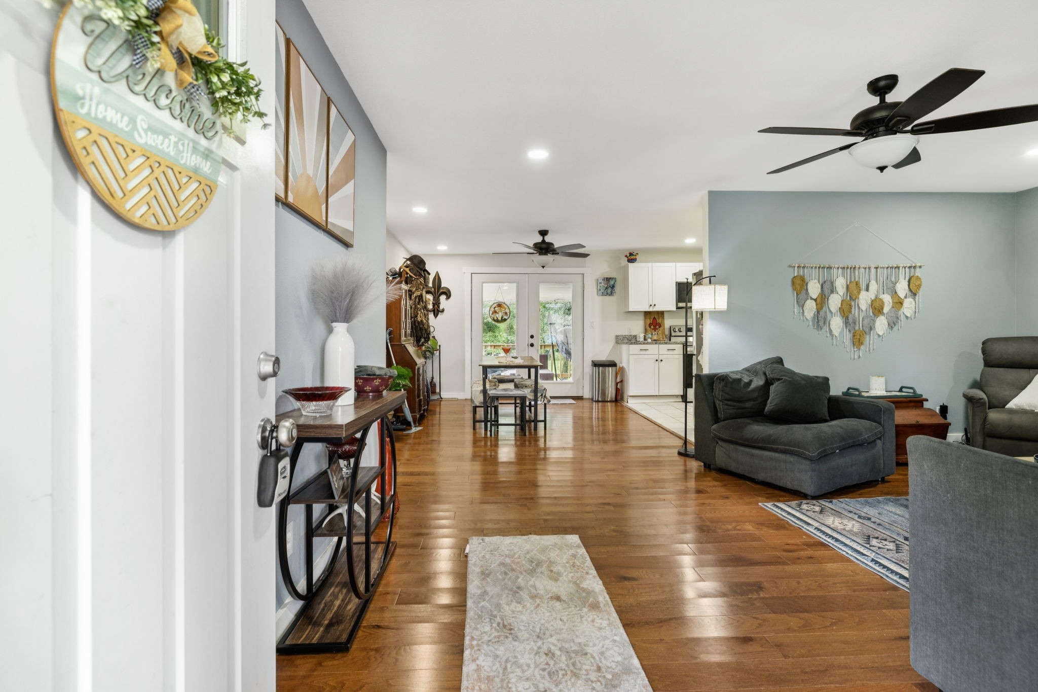 630 Lakeview Court Tennessee Ridge, TN 37178 - Photo 5 of 76 a living room with furniture and a wooden floor
