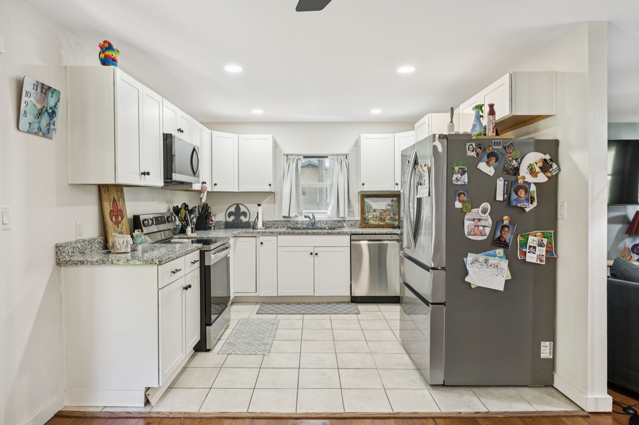 630 Lakeview Court Tennessee Ridge, TN 37178 - Photo 10 of 76 a kitchen with stainless steel appliances granite countertop a refrigerator and a sink