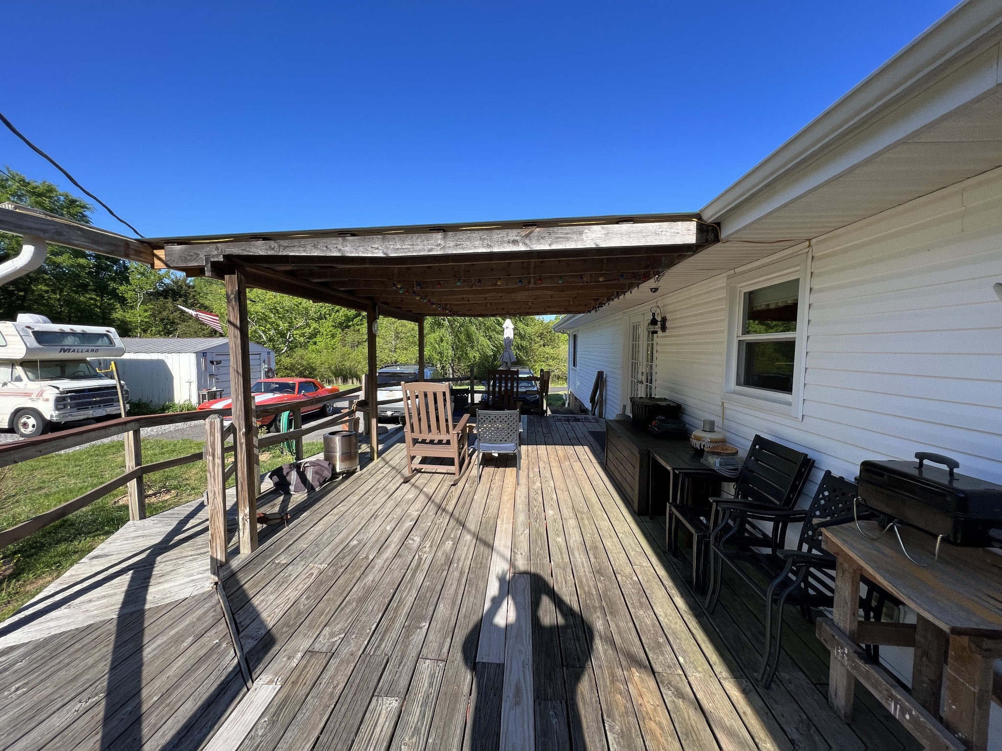 810 Rabbit Branch Road Shelbyville, TN 37160 - Photo 9 of 17 a view of a patio with wooden floor and outdoor seating