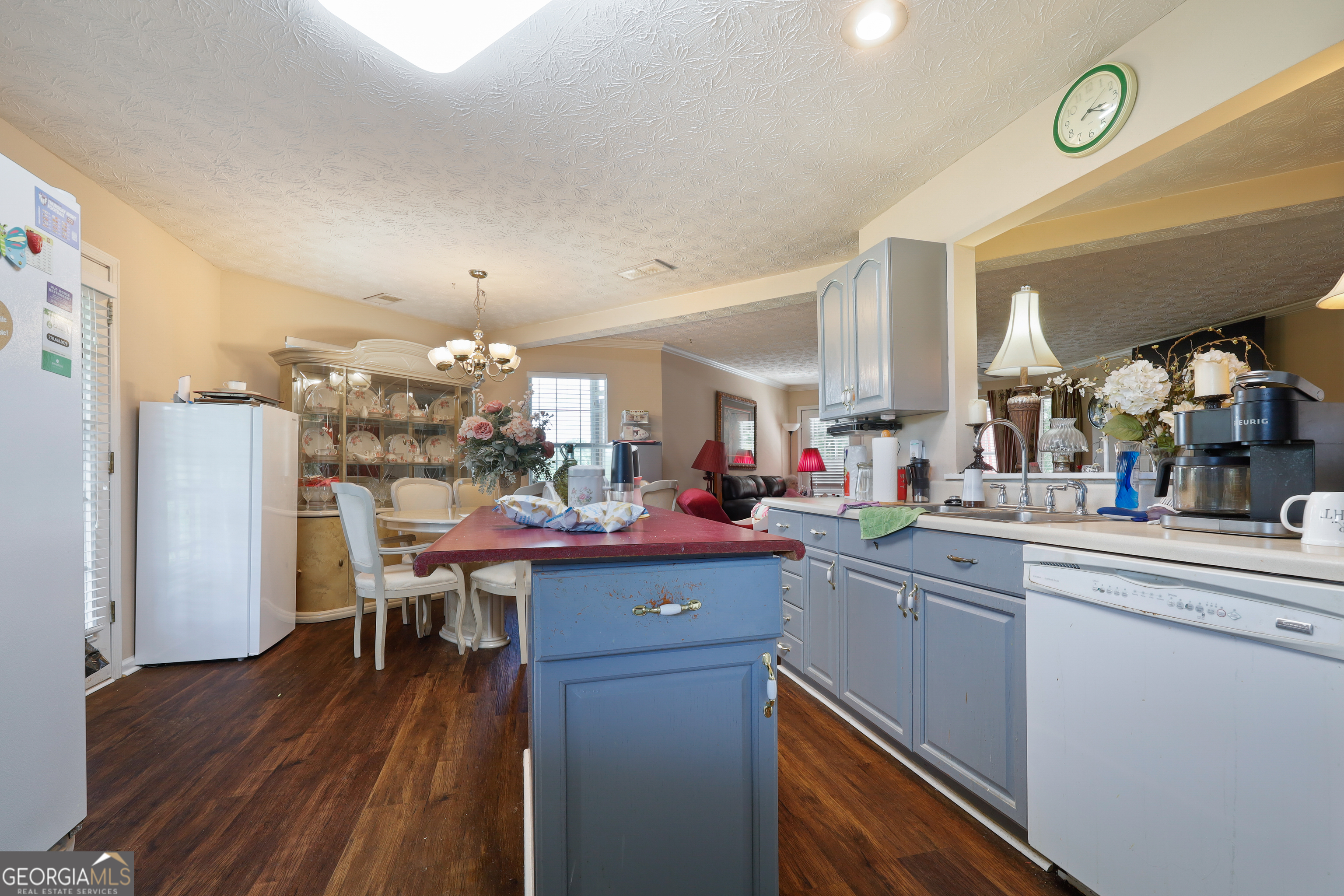 2433 Bear Creek Road Statham, GA 30666 - Photo 13 of 58 a kitchen with a sink cabinets and wooden floor