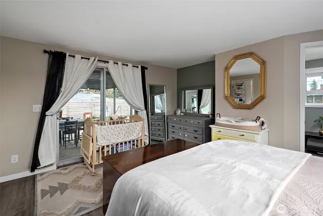 a bedroom with bed and window