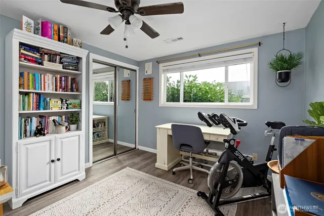 a workspace with furniture hardwood and a window