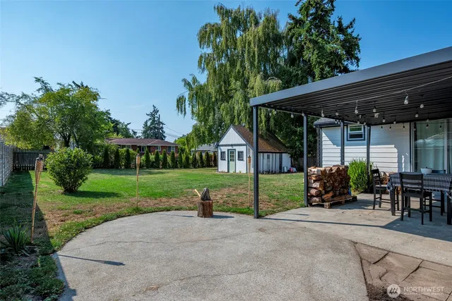 a front view of house with swing and flower garden