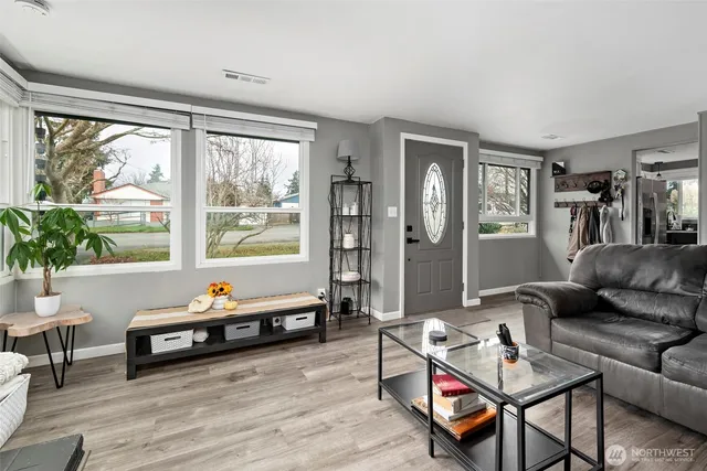 a living room with furniture and a window