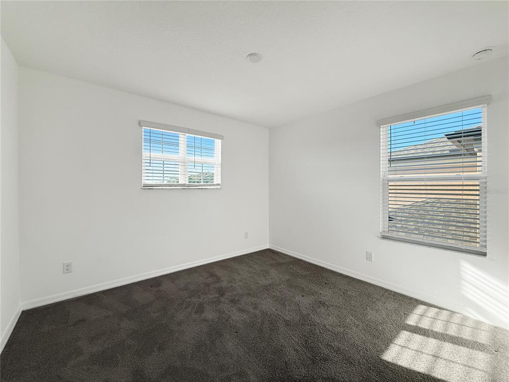 3023 Adams Cross Drive Zephyrhills, FL 33540 - Photo 14 of 36 a view of an empty room with a window