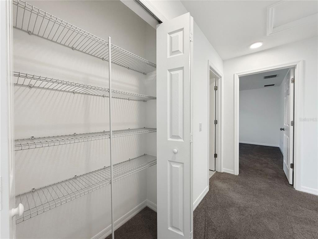 3023 Adams Cross Drive Zephyrhills, FL 33540 - Photo 15 of 36 a view of closet area