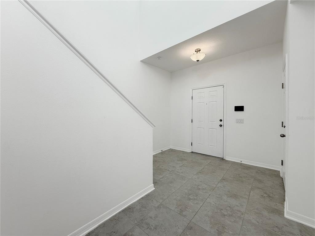 3023 Adams Cross Drive Zephyrhills, FL 33540 - Photo 17 of 36 a view of an empty room