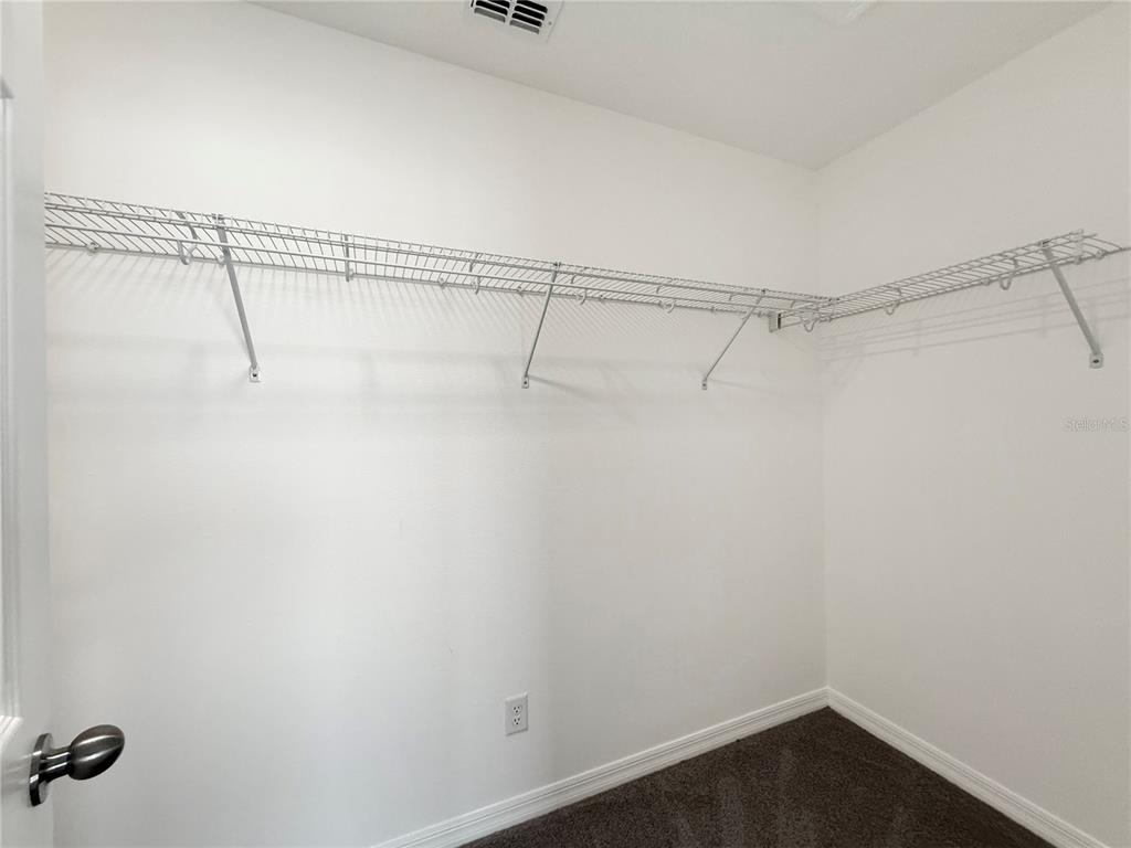 3023 Adams Cross Drive Zephyrhills, FL 33540 - Photo 21 of 36 a view of a room with racks on the wall