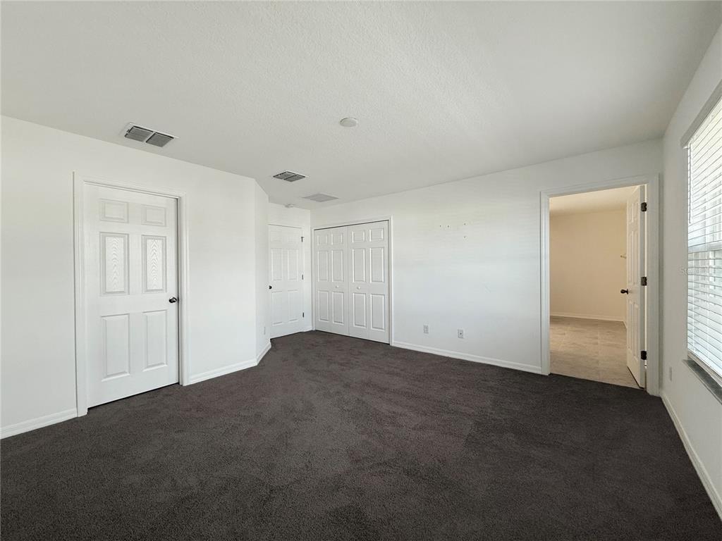 3023 Adams Cross Drive Zephyrhills, FL 33540 - Photo 22 of 36 a view of empty room