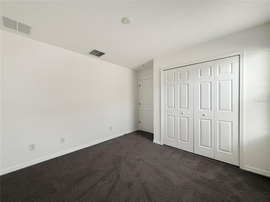 3023 Adams Cross Drive Zephyrhills, FL 33540 - Photo 25 of 36 a view of an empty room