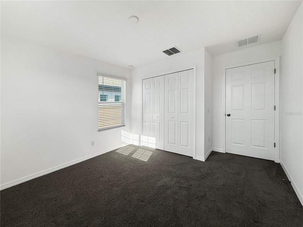 3023 Adams Cross Drive Zephyrhills, FL 33540 - Photo 26 of 36 a view of empty room