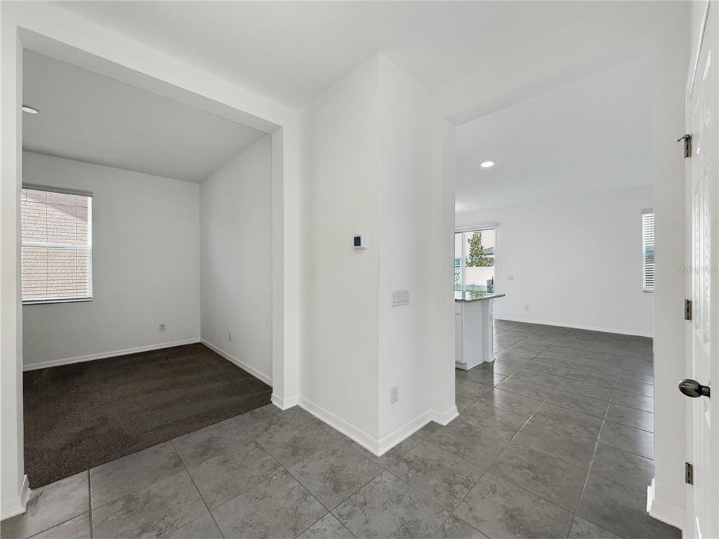 3023 Adams Cross Drive Zephyrhills, FL 33540 - Photo 3 of 36 an empty room with a bathroom