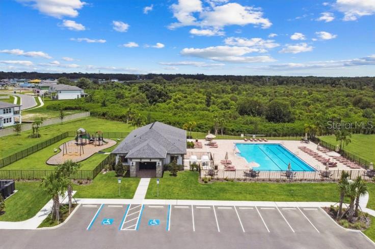3023 Adams Cross Drive Zephyrhills, FL 33540 - Photo 33 of 36 an aerial view of a house with garden space and street view
