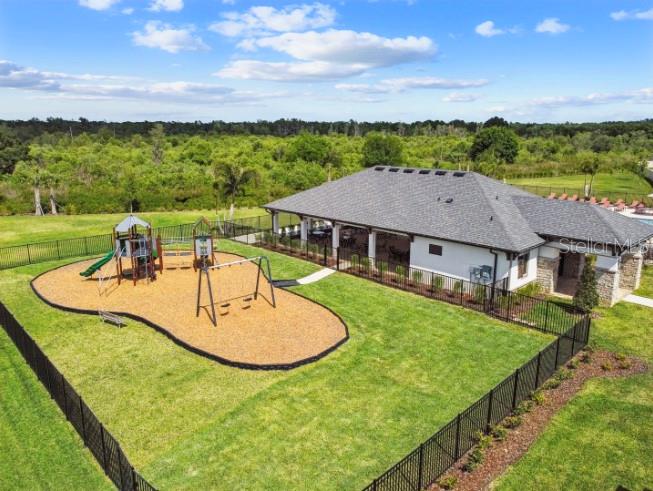 3023 Adams Cross Drive Zephyrhills, FL 33540 - Photo 36 of 36 an aerial view of a house with outdoor space