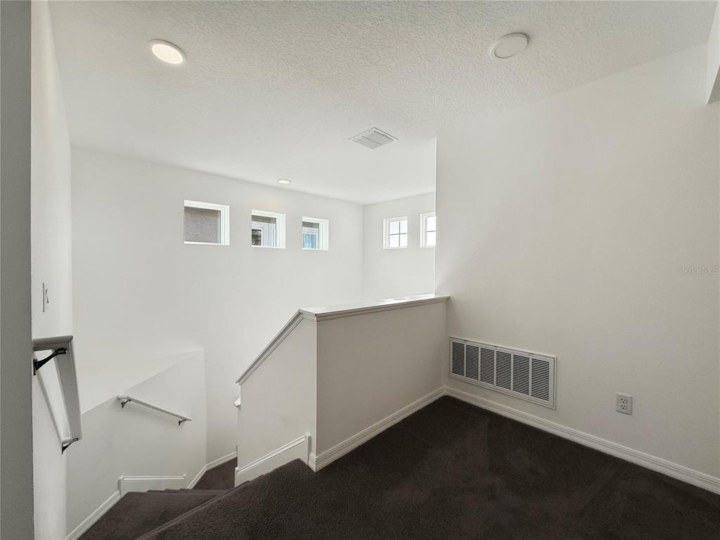 3023 Adams Cross Drive Zephyrhills, FL 33540 - Photo 8 of 36 a view of an empty room with a window