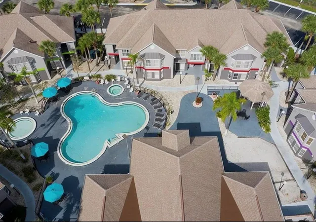 an aerial view of residential house with outdoor space and seating space