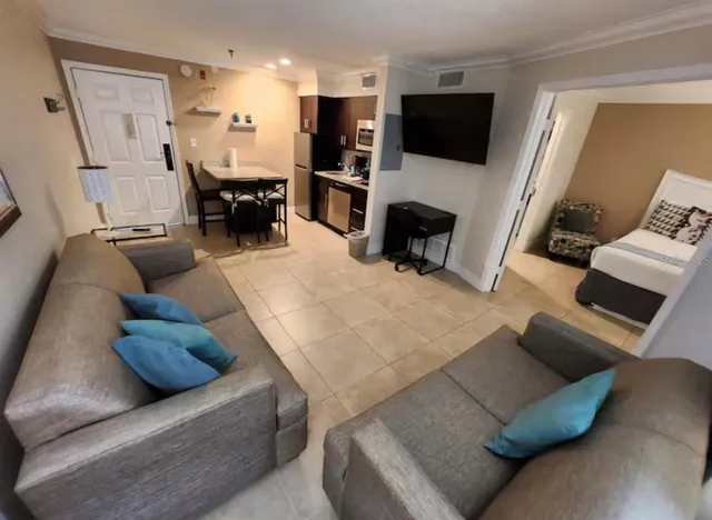 a living room with furniture and a flat screen tv