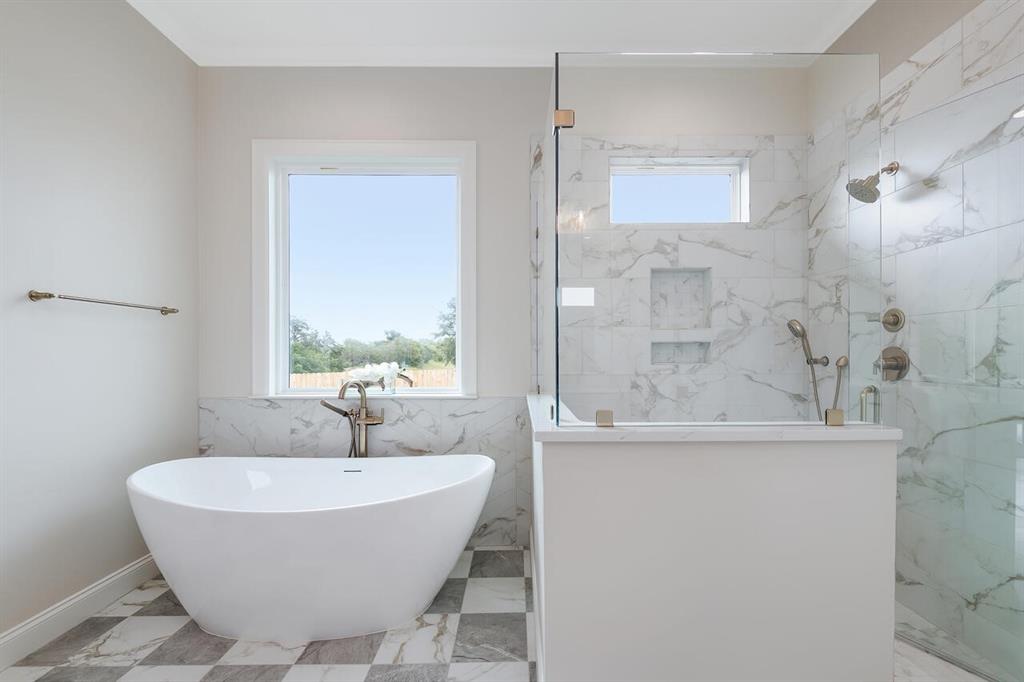 8005 Bee Cave Road China Spring, TX 76633 - Photo 27 of 40 a bathroom with a bathtub and a sink