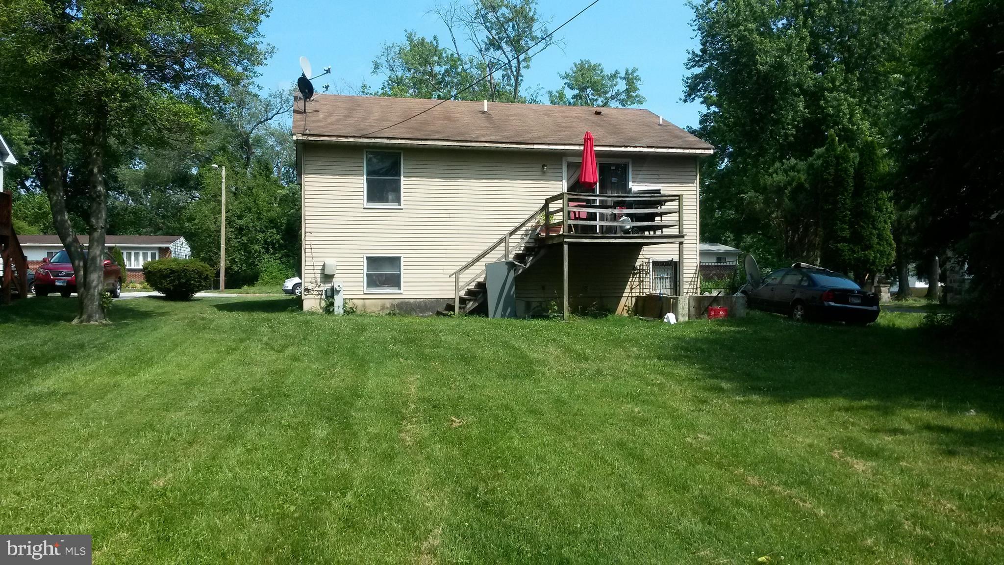3608 Rusty Rock Road Randallstown, MD 21133 - Photo 2 of 2 a front view of house with yard