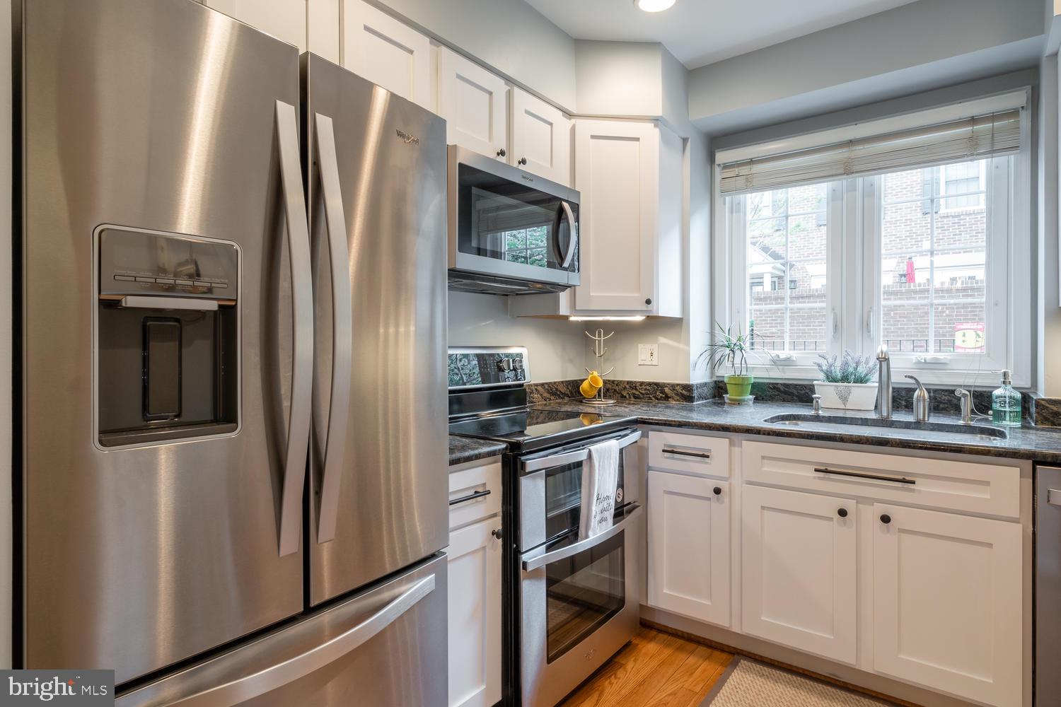 1221 Portner Road Alexandria, VA 22314 - Photo 14 of 34 a kitchen with stainless steel appliances a refrigerator sink and microwave