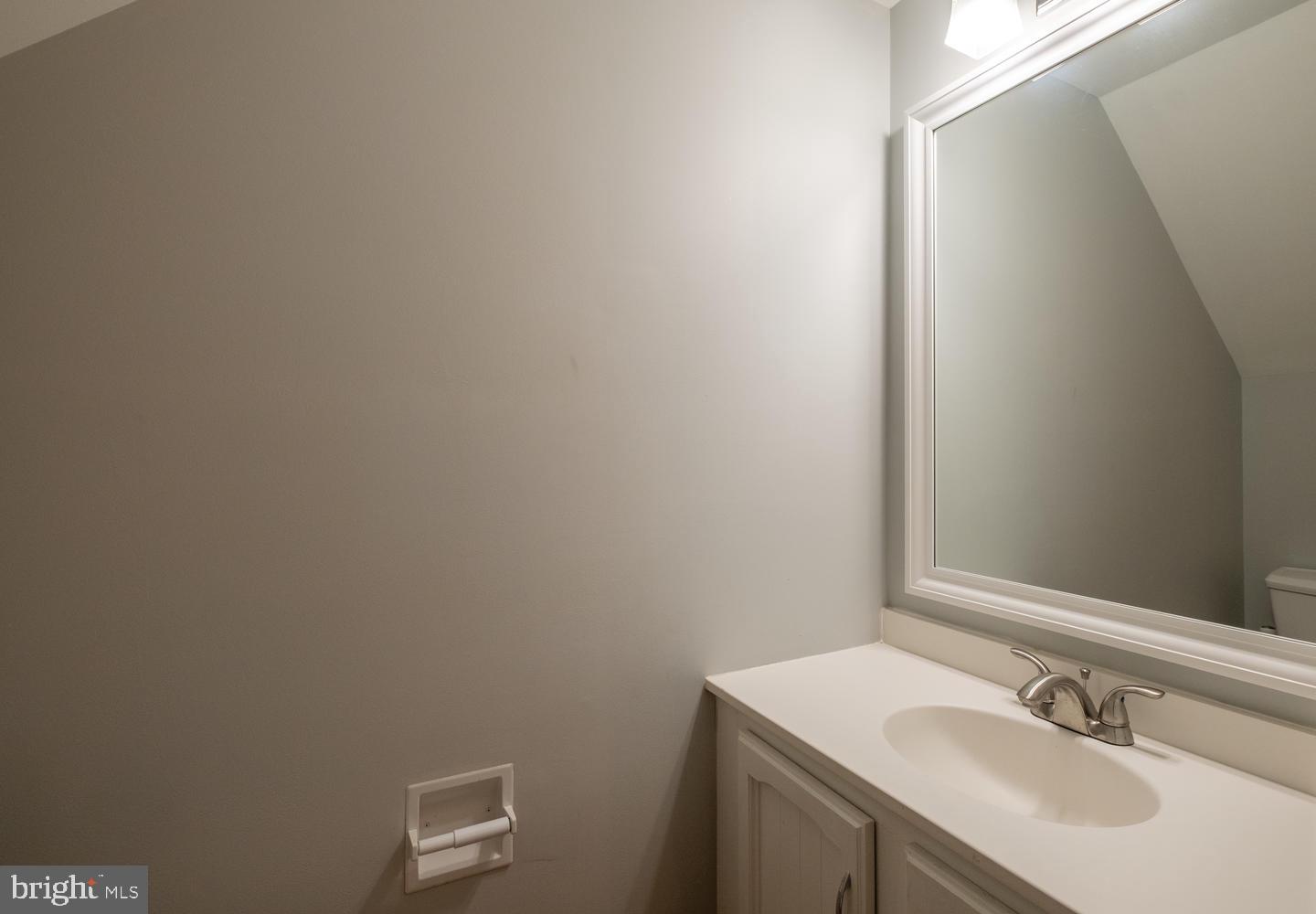 1221 Portner Road Alexandria, VA 22314 - Photo 17 of 34 a bathroom with a sink and a mirror