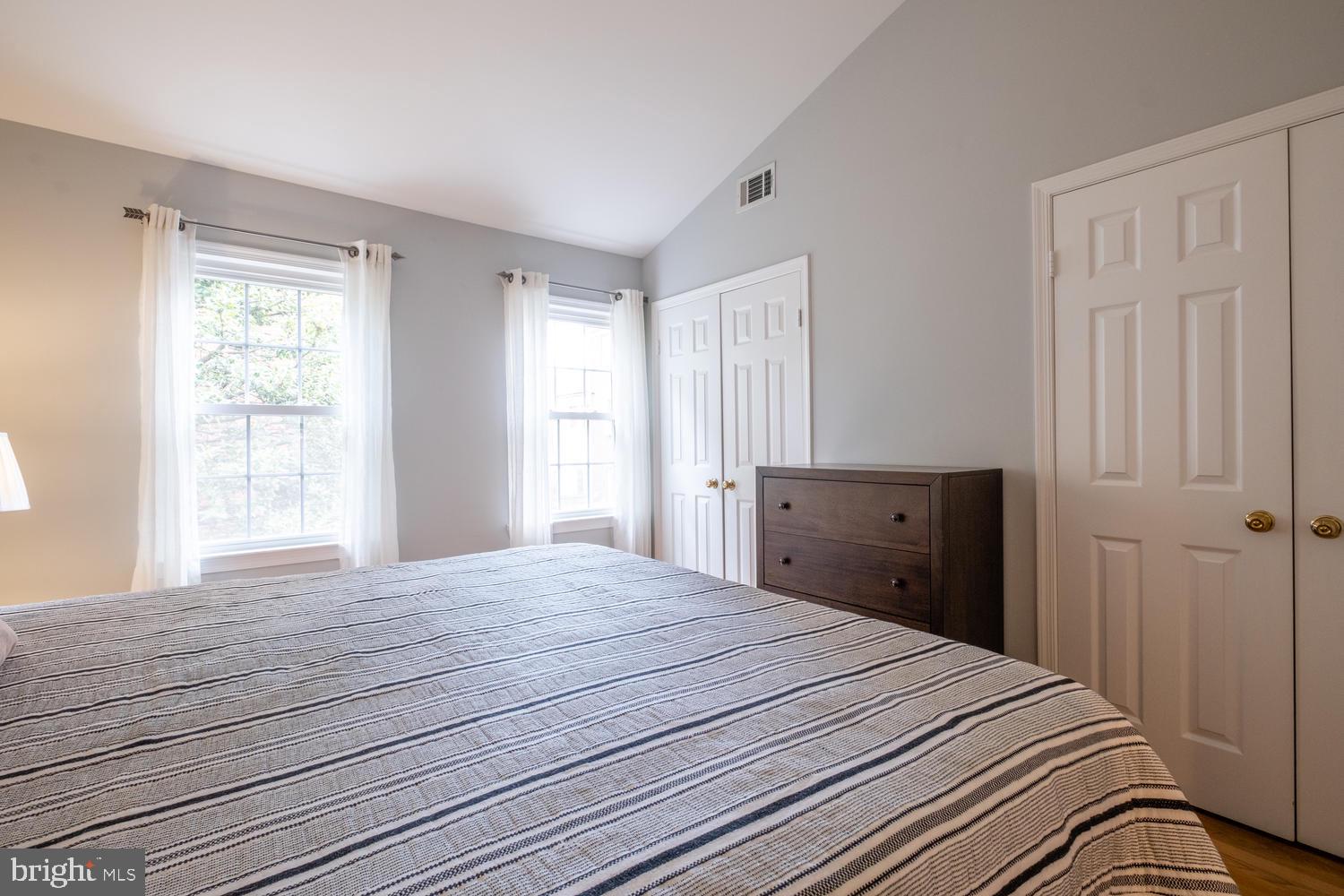 1221 Portner Road Alexandria, VA 22314 - Photo 21 of 34 a bedroom with a bed and a window
