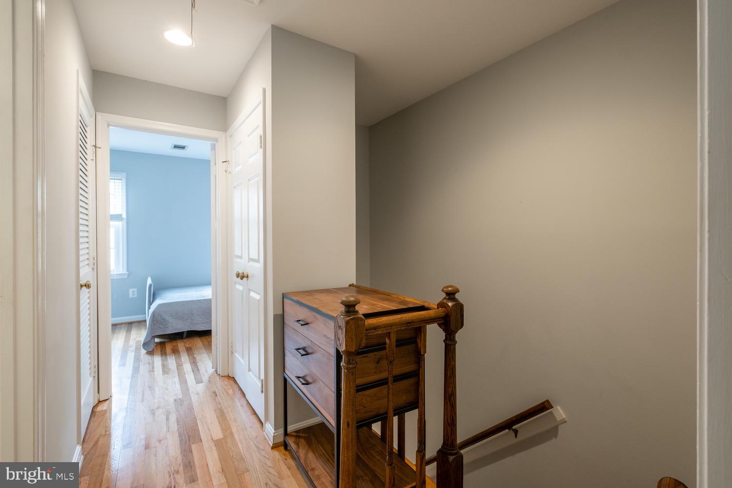 1221 Portner Road Alexandria, VA 22314 - Photo 22 of 34 a view of a hallway with wooden floor and bedroom