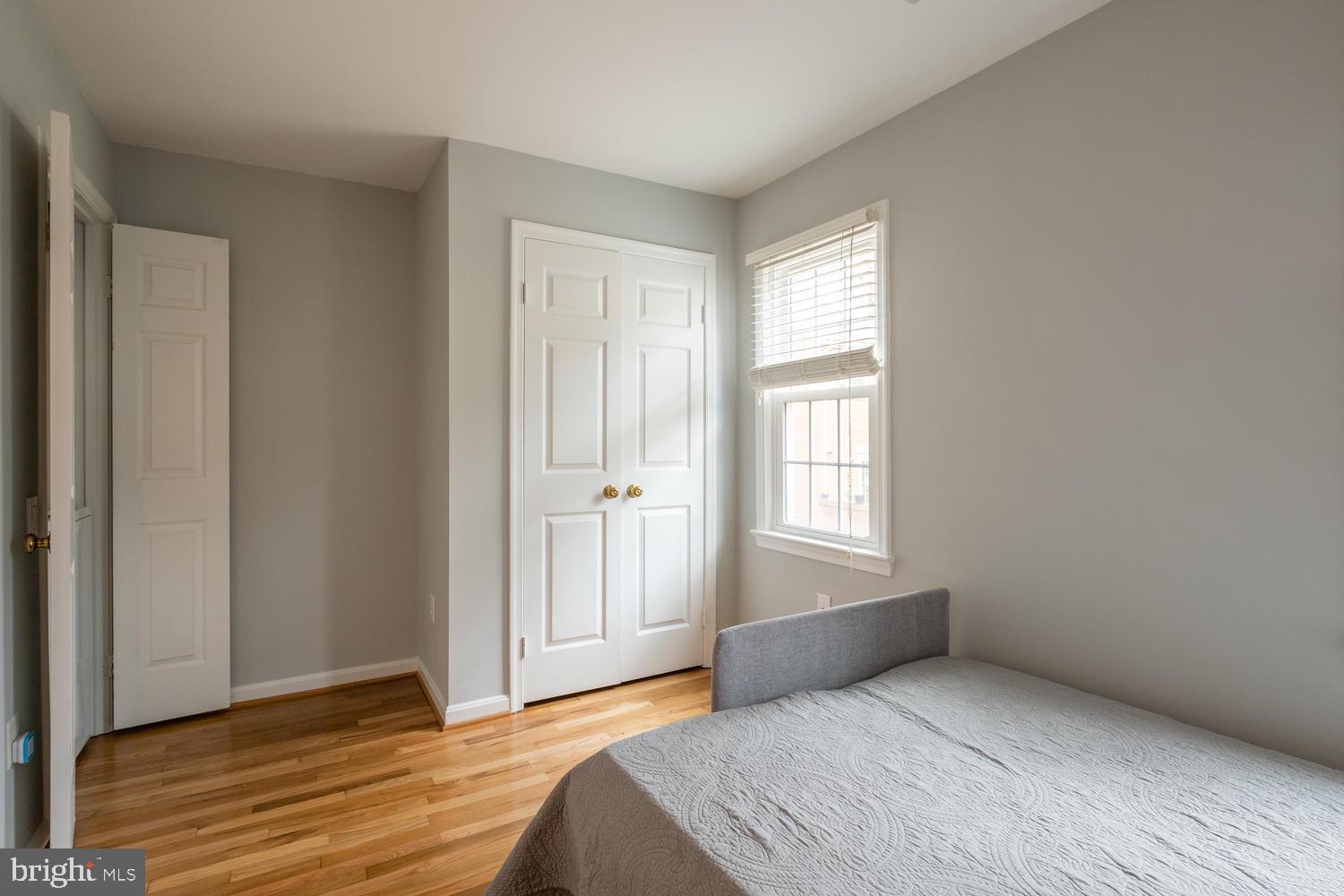 1221 Portner Road Alexandria, VA 22314 - Photo 26 of 34 a bedroom with a bed and a window