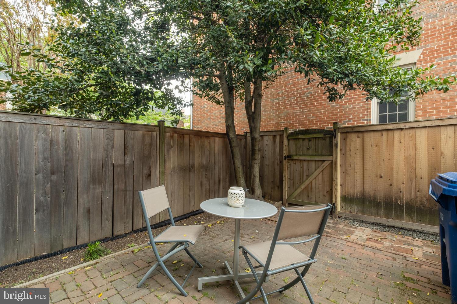 1221 Portner Road Alexandria, VA 22314 - Photo 31 of 34 a backyard of a house with table and chairs
