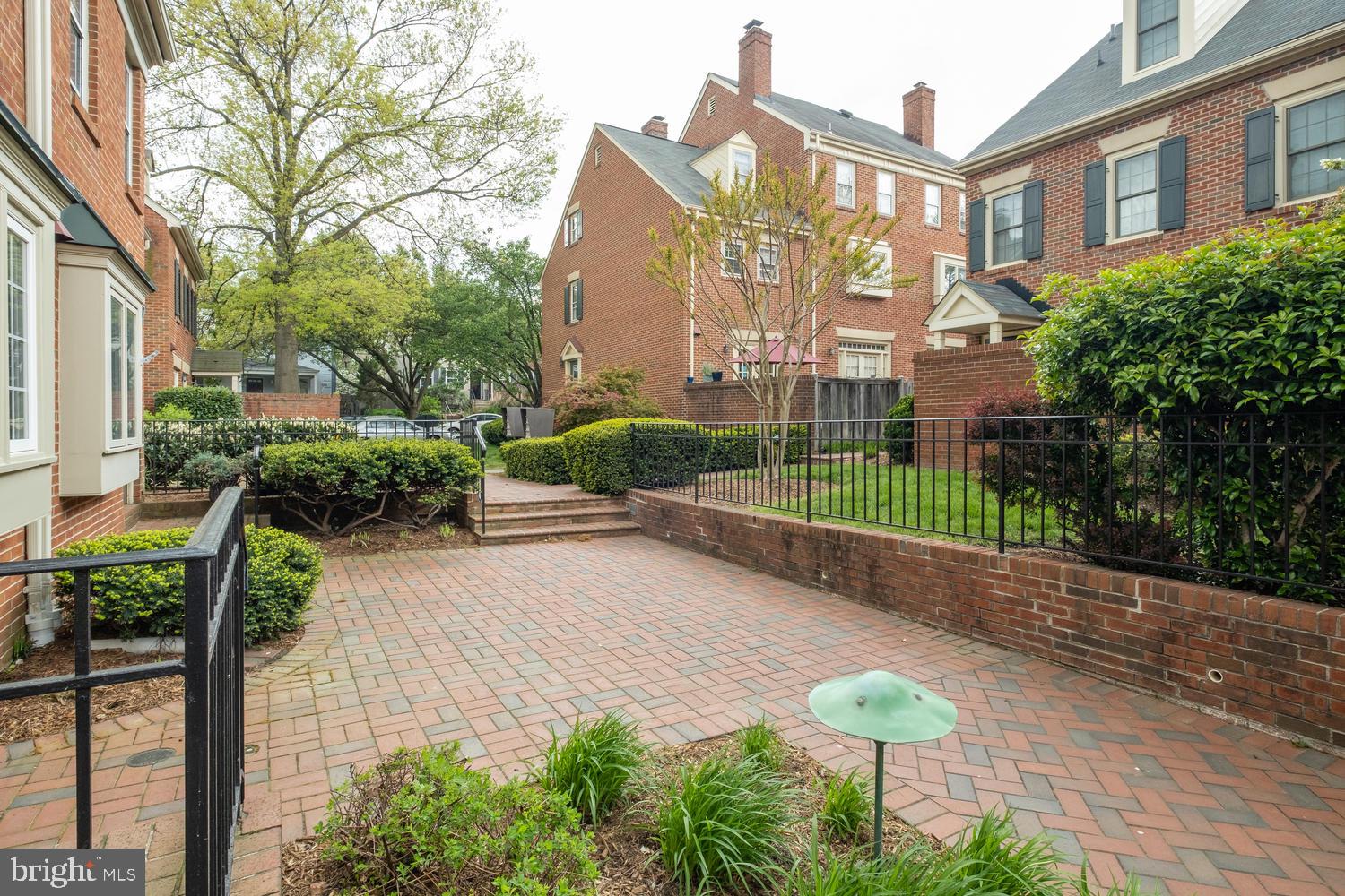 1221 Portner Road Alexandria, VA 22314 - Photo 34 of 34 a view of a street with potted plants and a large tree