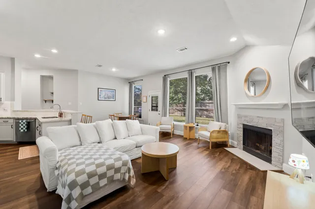 a living room with furniture and a fireplace